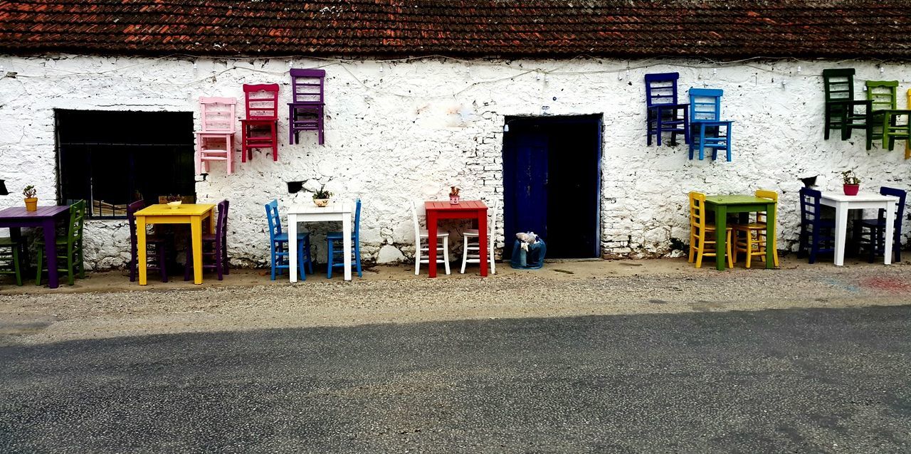 Chairs with tables at sidewalk cafe