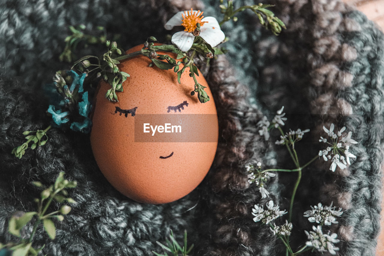 Close-up of easter egg with flower crown
