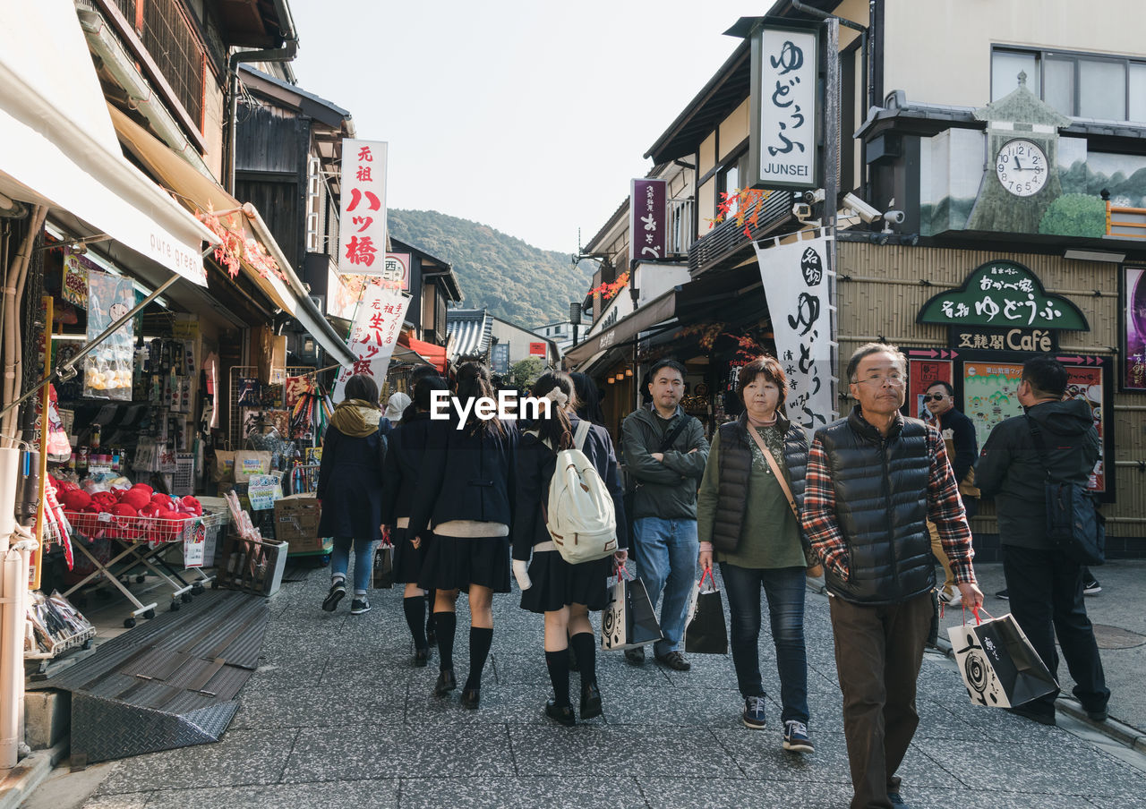 PEOPLE WALKING ON STREET IN STORE