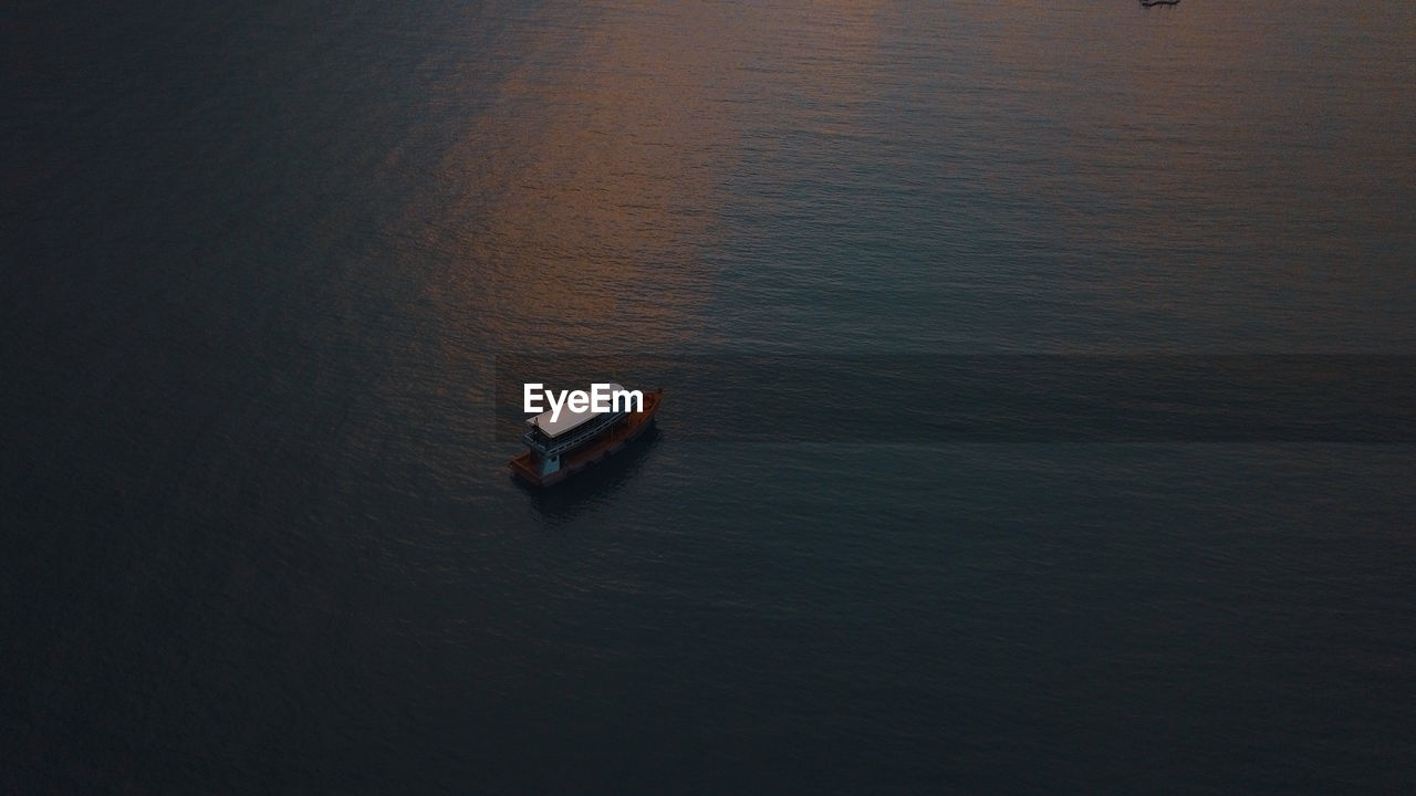 High angle view of boat sailing on sea