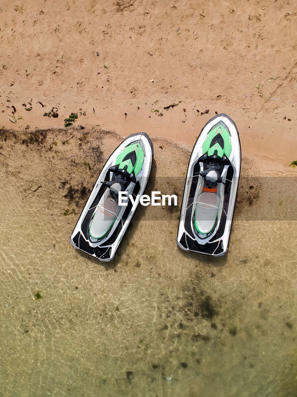 Directly above view of jet skis at beach