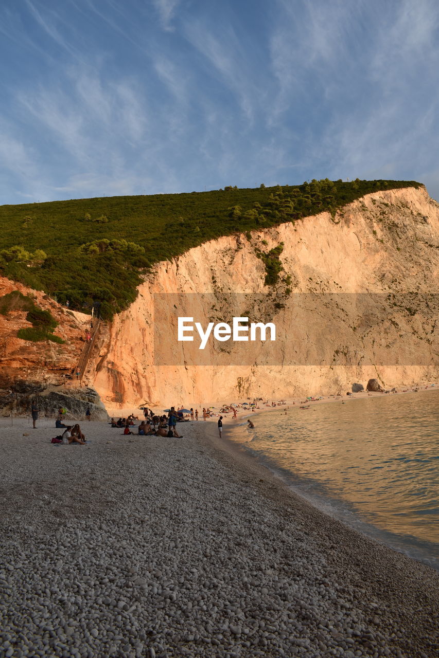 cliff, terrain, nature, rock, land, sky, day, water, beauty in nature, scenics - nature, reflection, outdoors, wall, cloud, travel, plant, travel destinations, sunlight, no people, geology, high angle view, landscape, environment, panoramic, coast, sea, beach, tranquility, non-urban scene, mountain