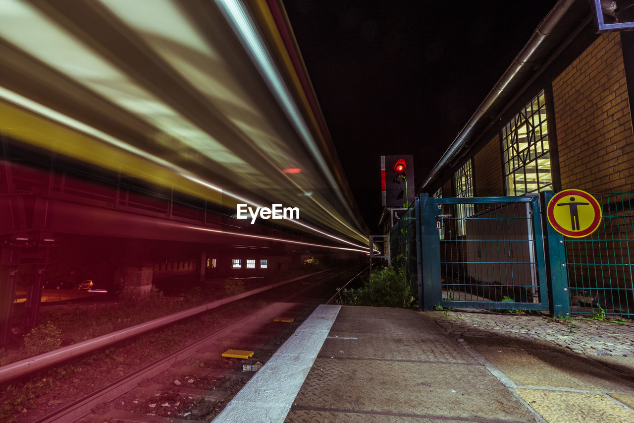 Speeding blurred train at railway station