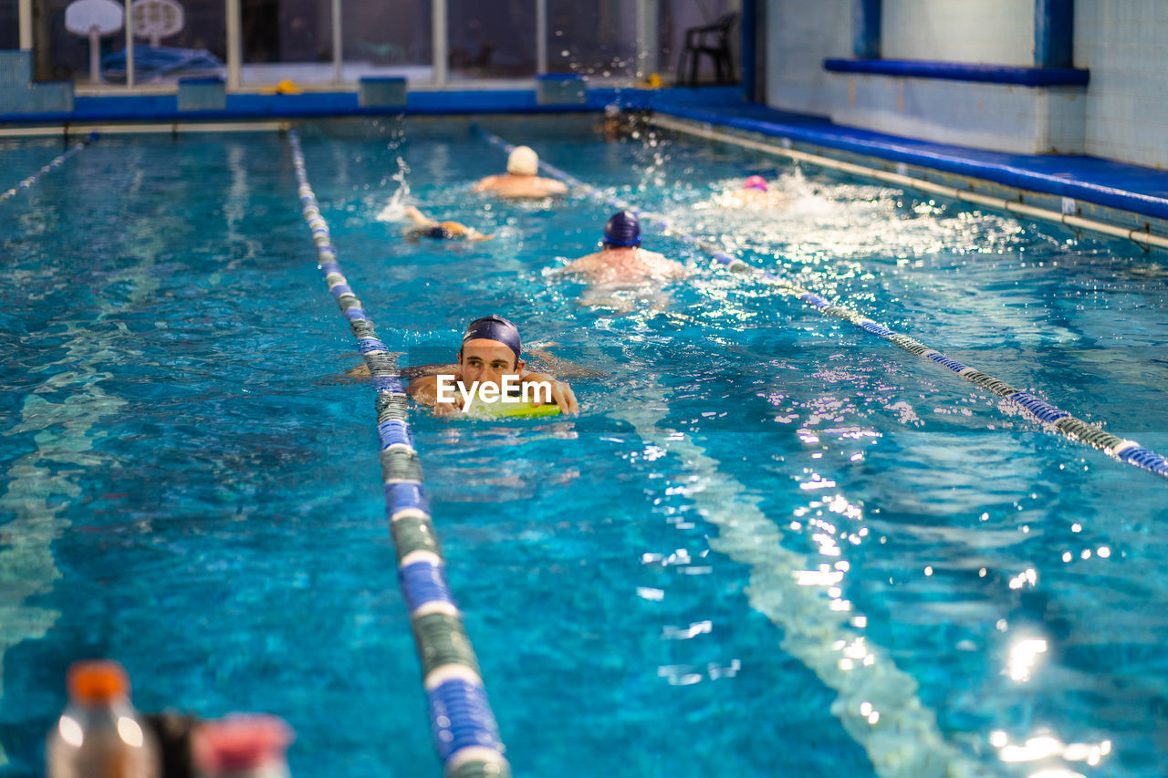 High angle view of man swimming in pool