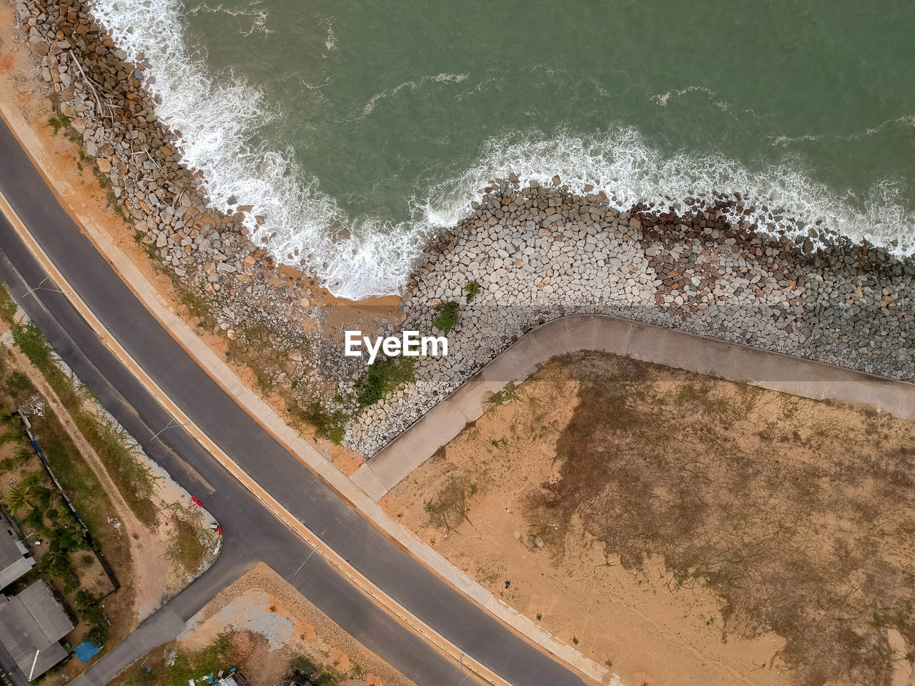 Aerial view of road by sea