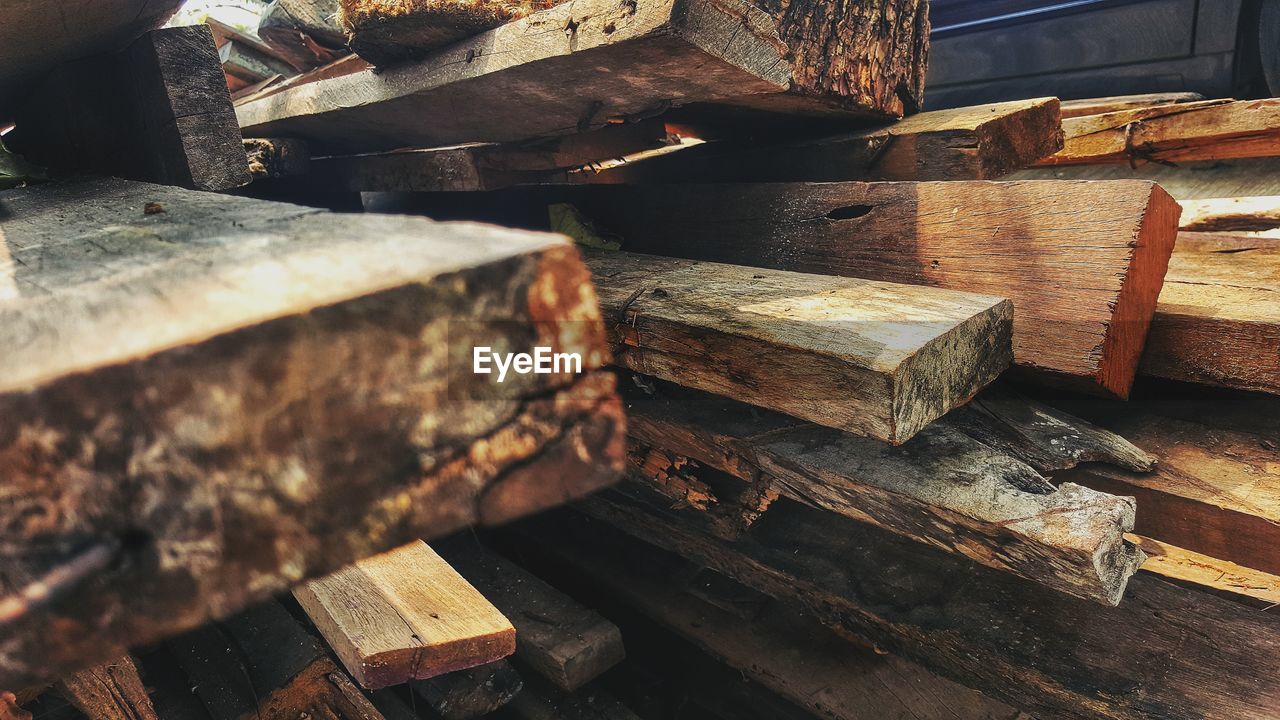 High angle view of old stack on wooden table