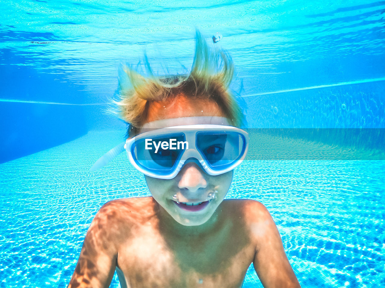 Portrait of boy in swimming pool