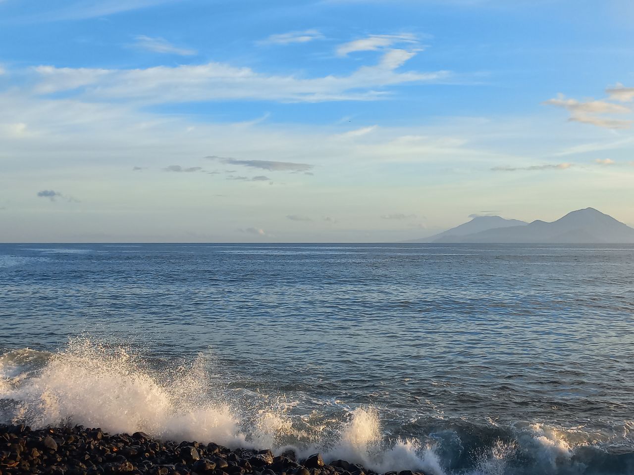 sea, water, horizon, sky, shore, body of water, ocean, beauty in nature, scenics - nature, wave, horizon over water, coast, motion, cloud, wind wave, land, beach, nature, sand, tranquil scene, morning, tranquility, sports, no people, idyllic, outdoors, water sports, sunrise, day, bay, sunlight, non-urban scene, seascape, splashing, travel destinations