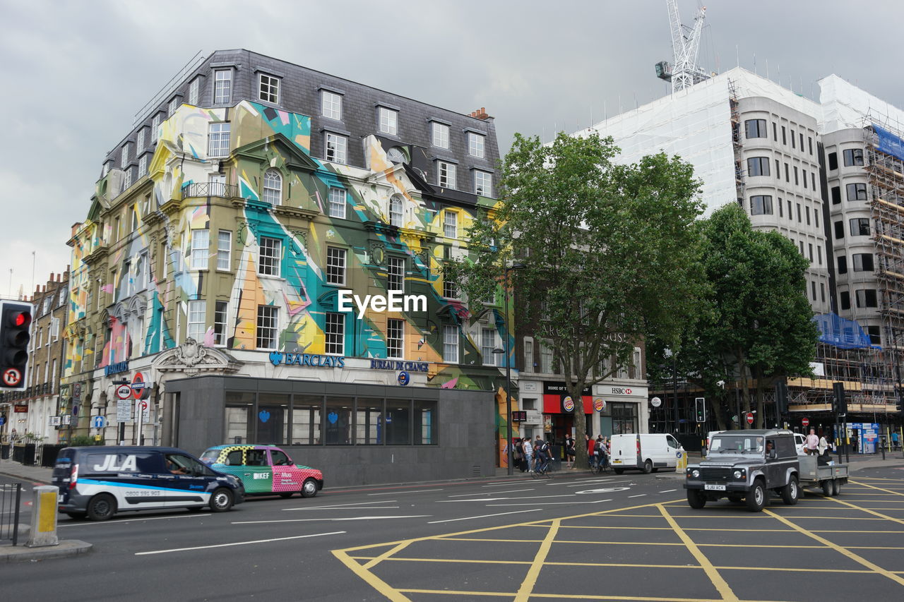 VIEW OF CITY STREET AGAINST SKY