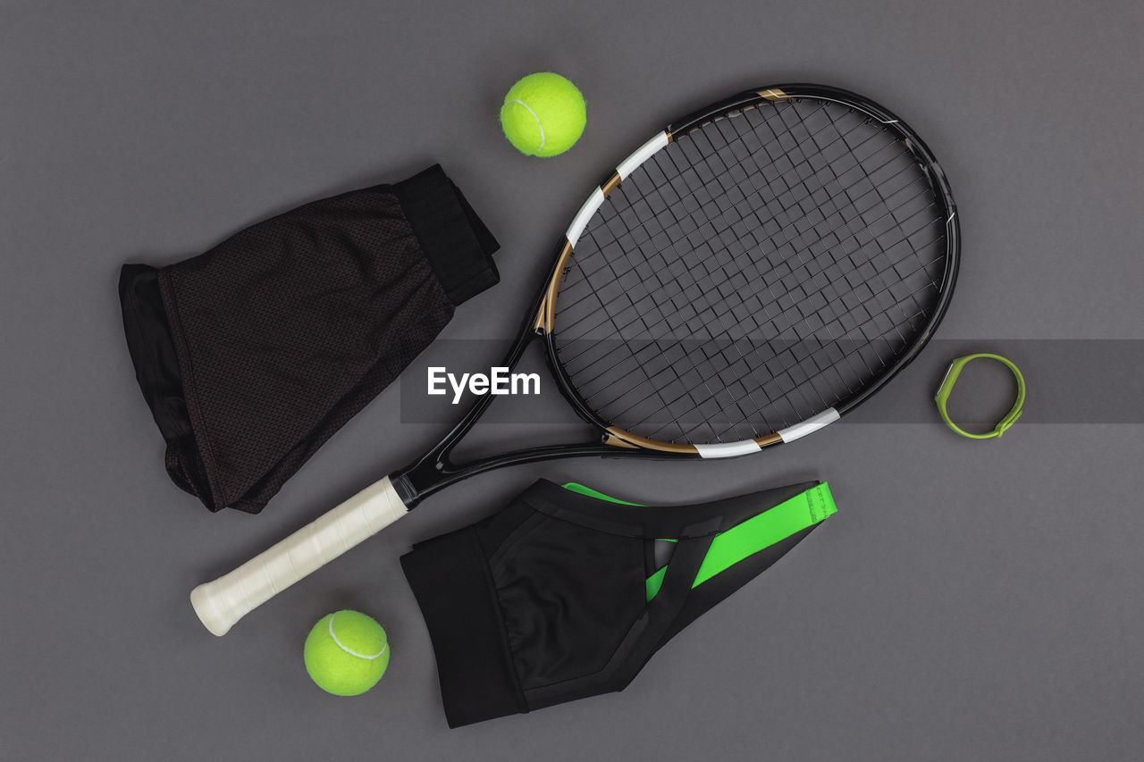 high angle view of tennis and racket and ball on table