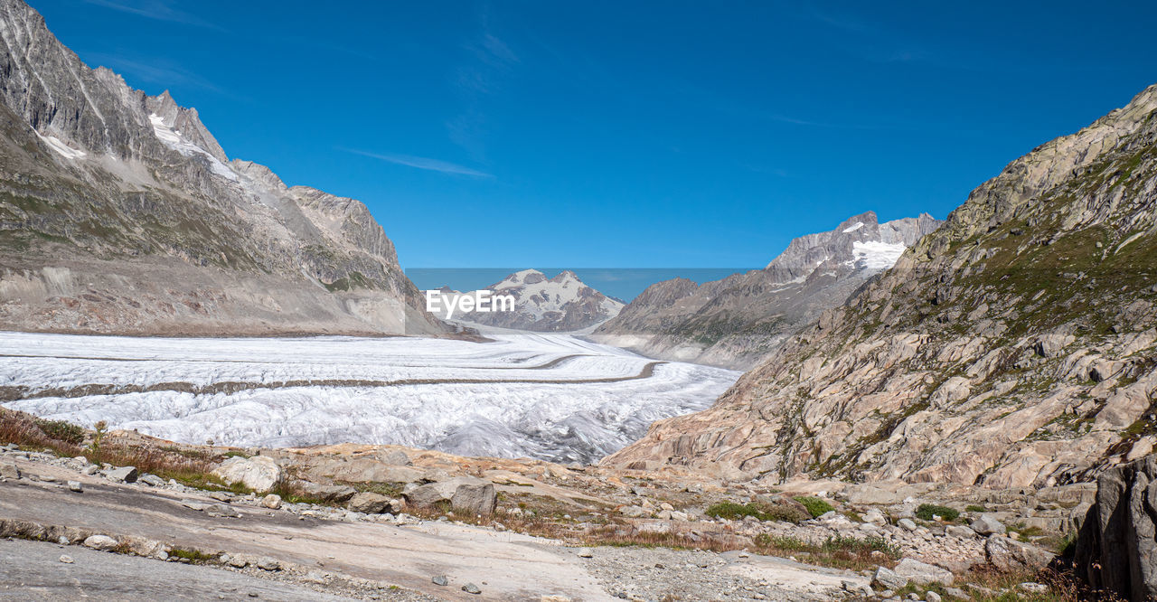 Scenic view of mountains against sky during winter