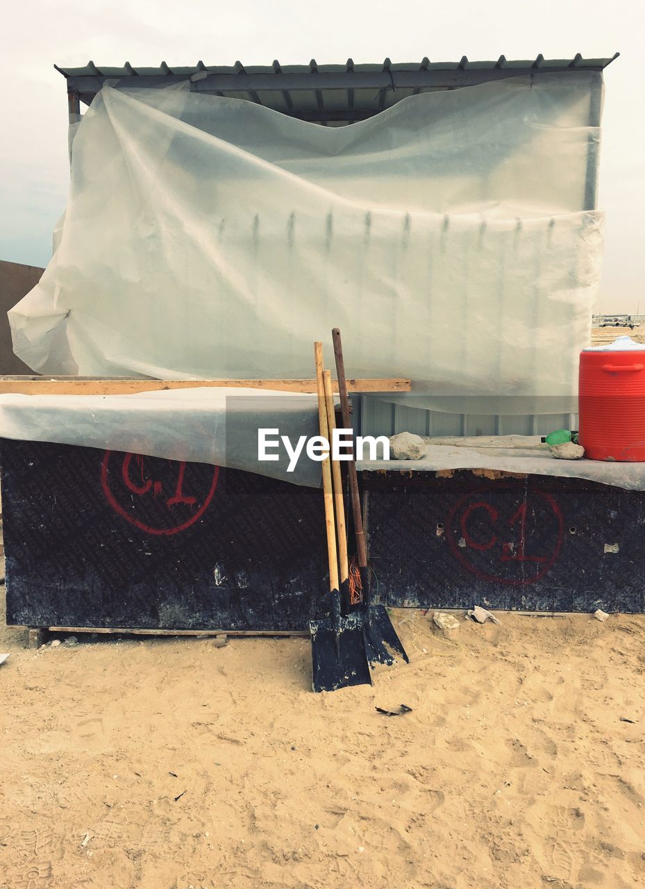 Shovel and resting shelter at construction site 