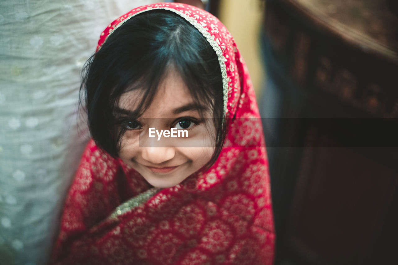 Close-up portrait of smiling girl in sari