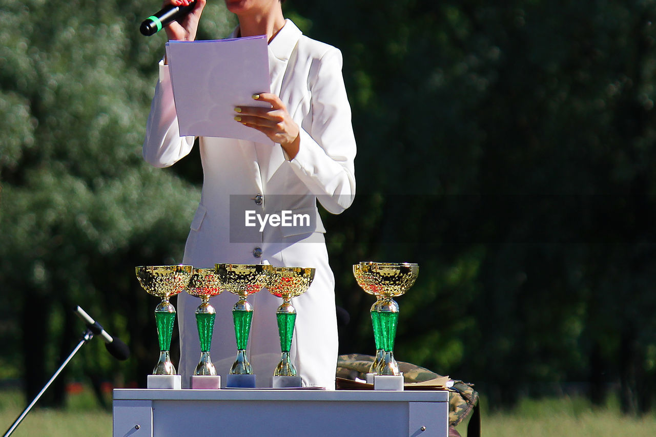 The ceremony of awarding cups and medals to the winners. solemn announcement and call to the stage