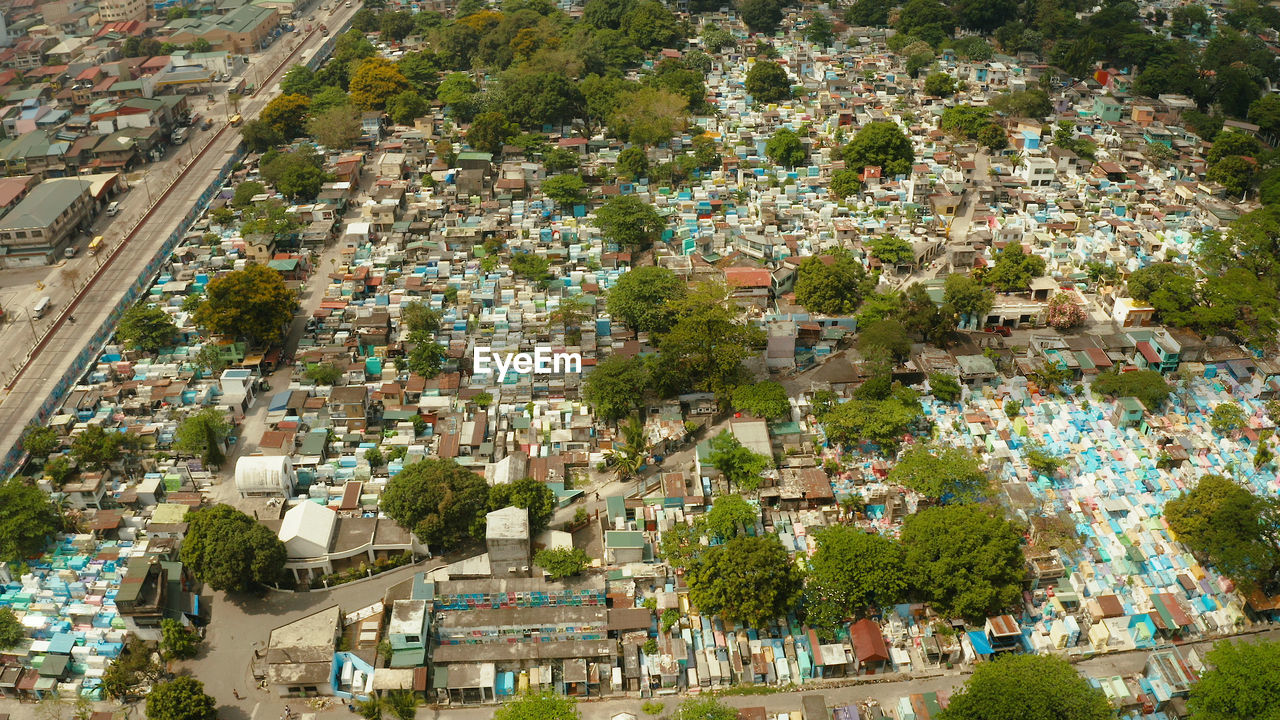 Famous cemetery in the city of manila, where people live among the graves and crypts top view. 