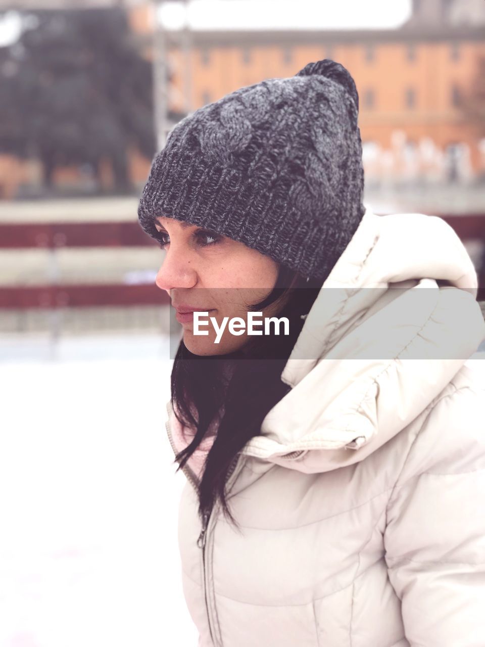 Young woman looking away during winter