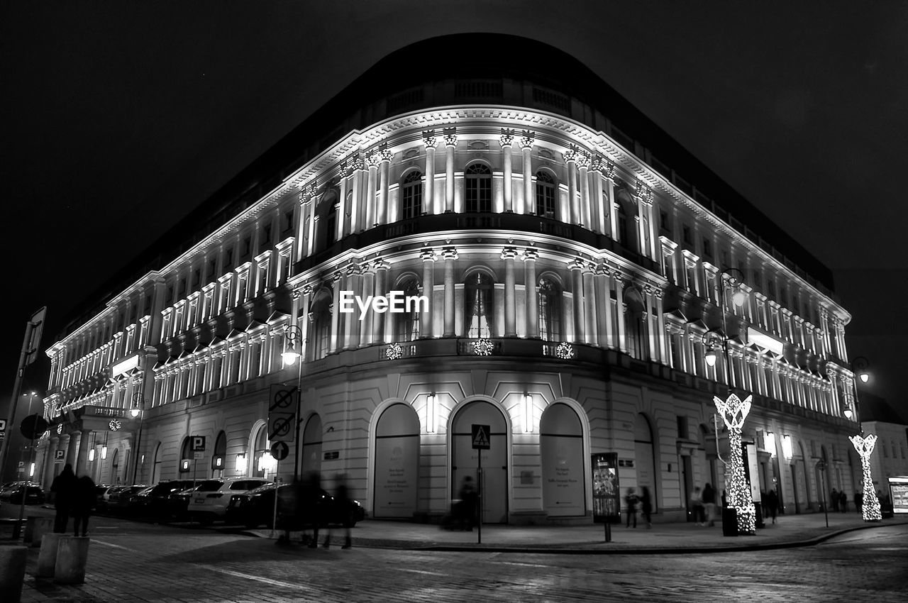 ILLUMINATED BUILDING AGAINST SKY