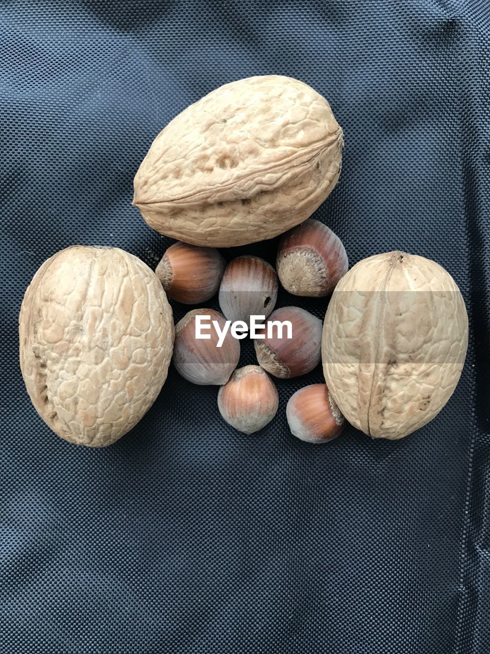 HIGH ANGLE VIEW OF EGGS ON TABLE AGAINST WHITE BACKGROUND