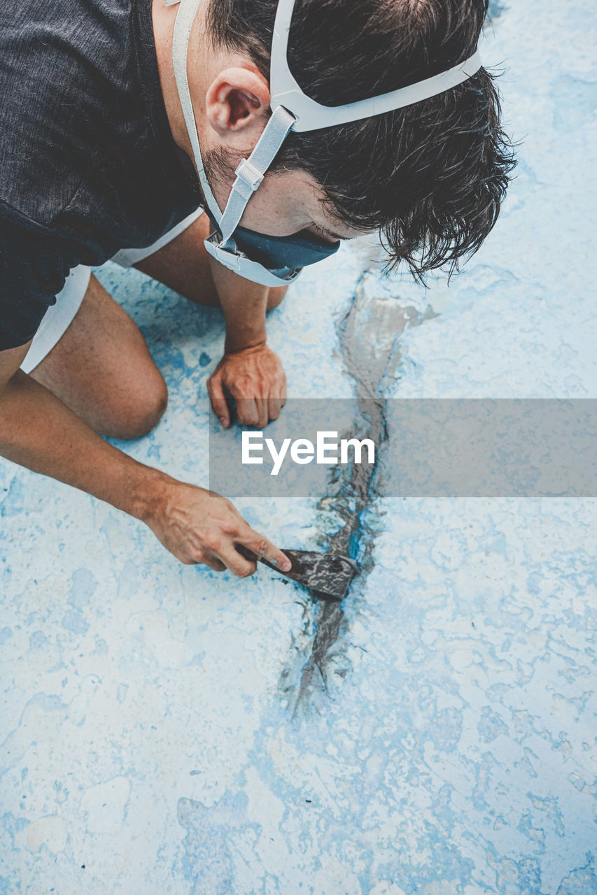 High angle view of man swimming in pool