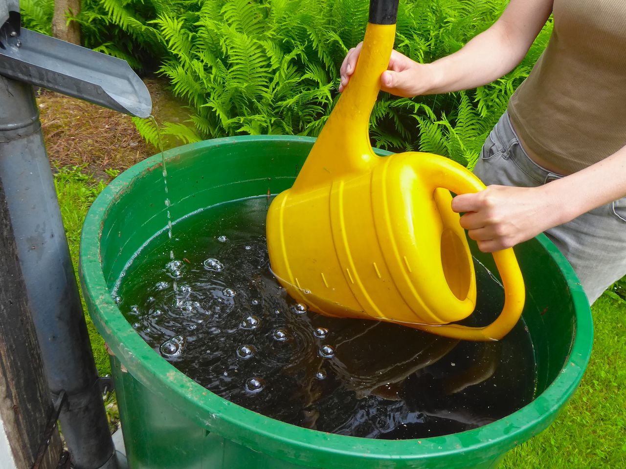 HIGH ANGLE VIEW OF CHILD ON YELLOW WATER