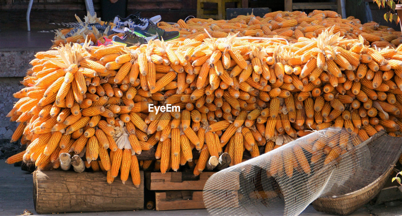 STACK OF FIREWOOD FOR SALE IN MARKET