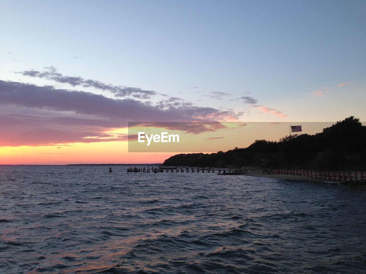 Scenic view of sea at dusk