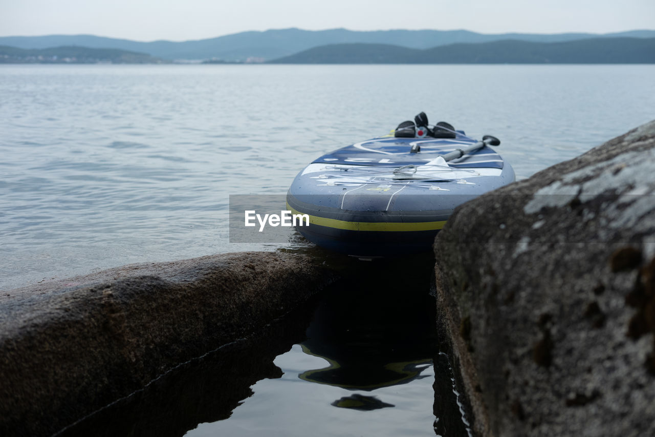 NAUTICAL VESSEL ON LAKE