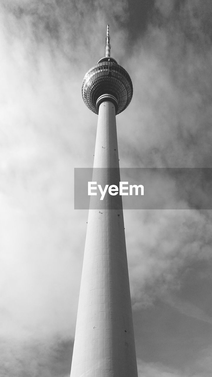 LOW ANGLE VIEW OF TOWER AGAINST CLOUDY SKY