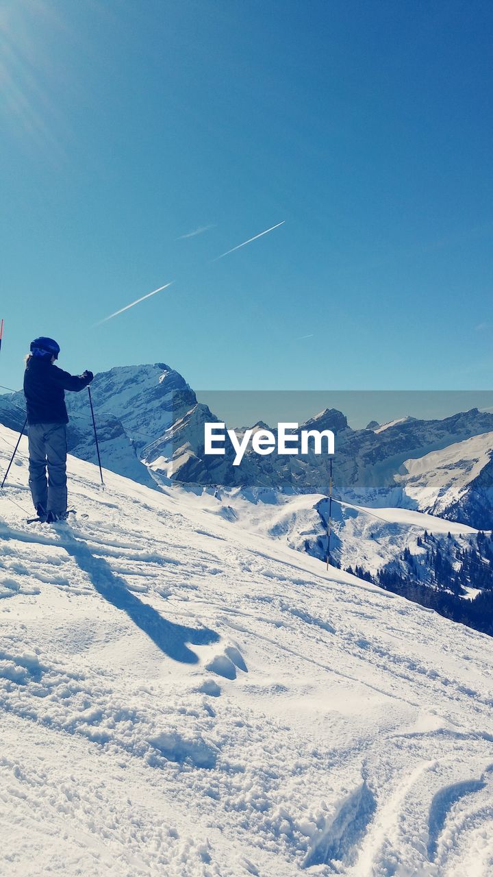 Person skiing on snow covered mountain at villars-sur-ollon