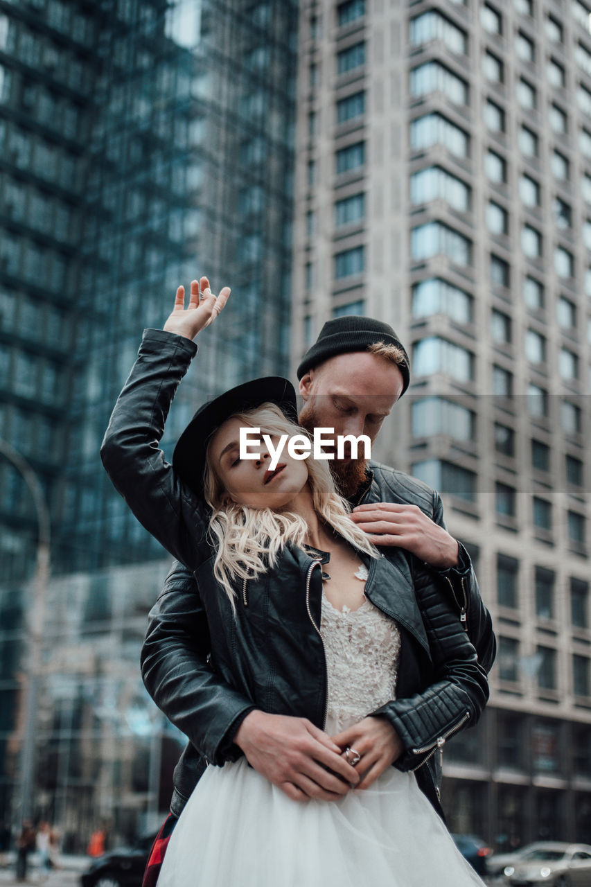 Young couple standing in city