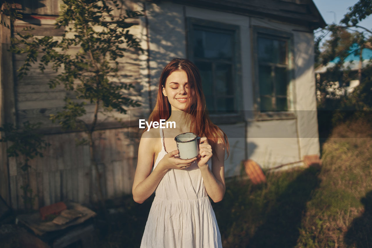 Young woman with coffee cup