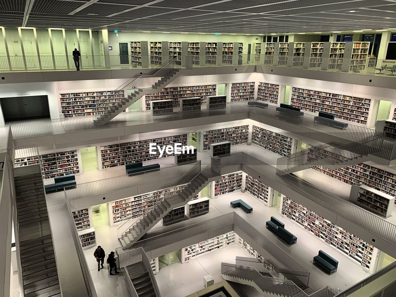 HIGH ANGLE VIEW OF PEOPLE WALKING IN UNDERGROUND BUILDING