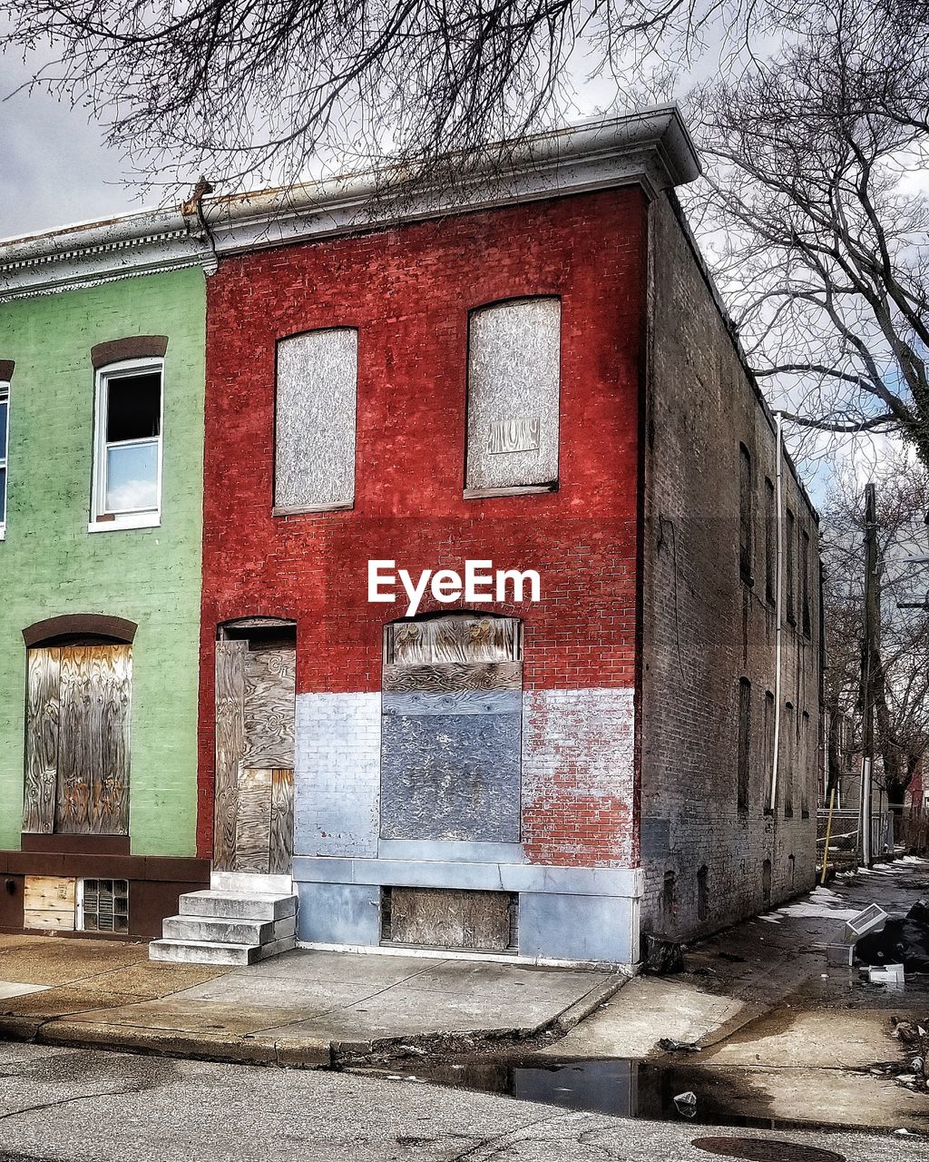 VIEW OF BUILDING WITH BARE TREE