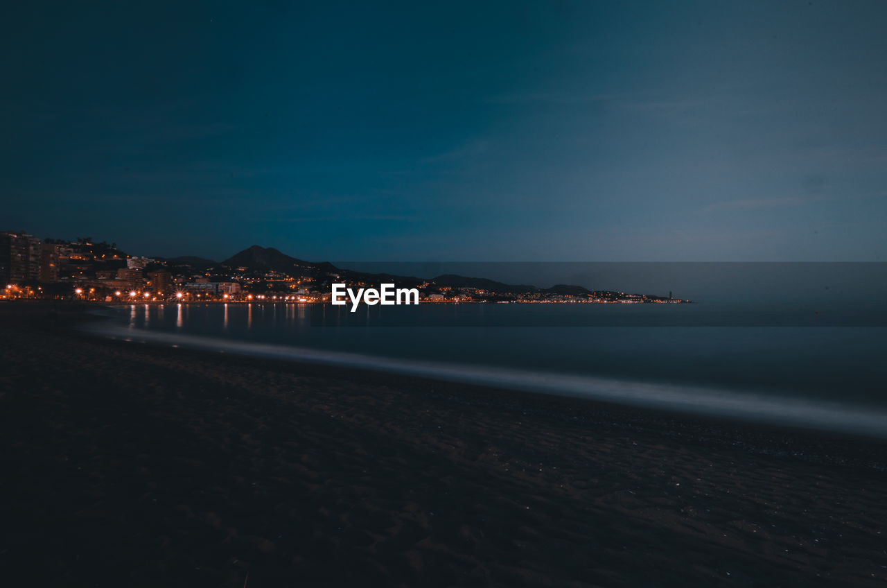 Scenic view of sea against sky at night