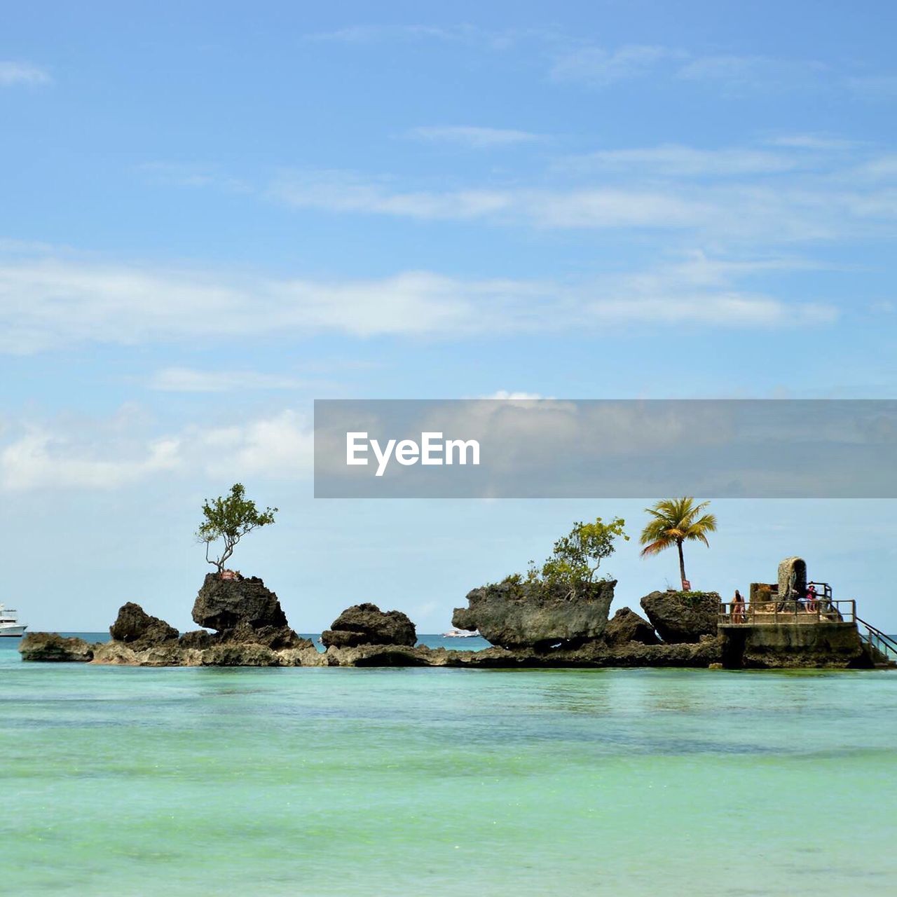 SCENIC VIEW OF SEA WITH MOUNTAIN IN BACKGROUND