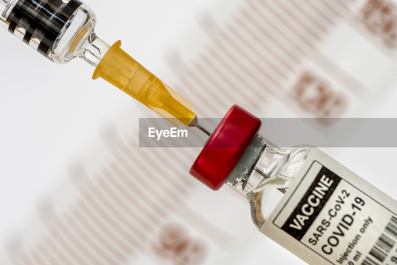Vaccination with serum and syringe against covid-19 virus