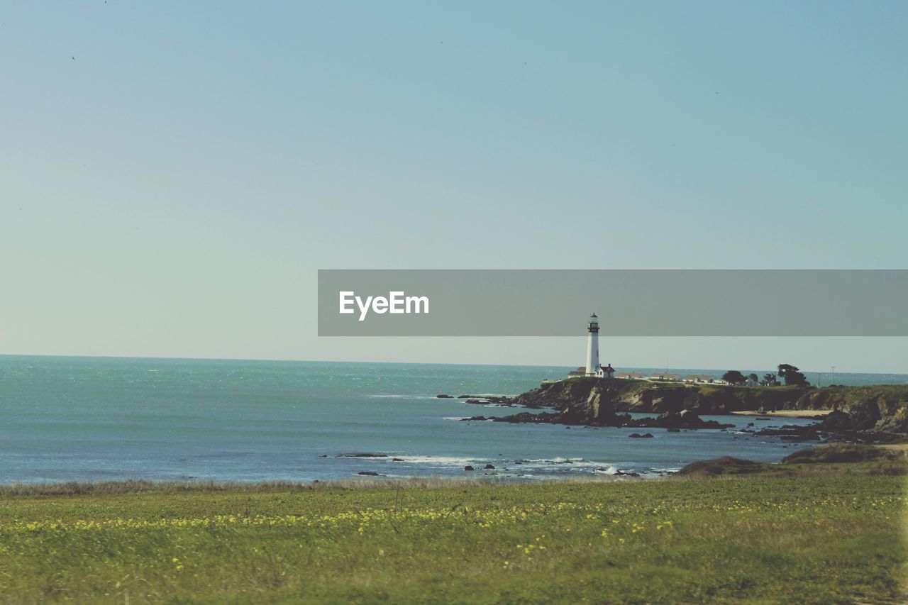 View of calm blue sea against clear sky