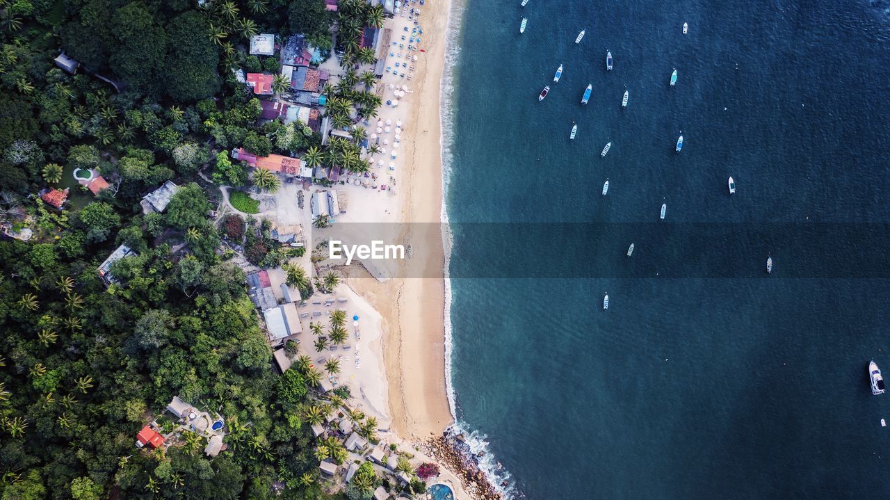 Aerial drone view of beach and ocean in puerto vallarta, jalisco mexico.