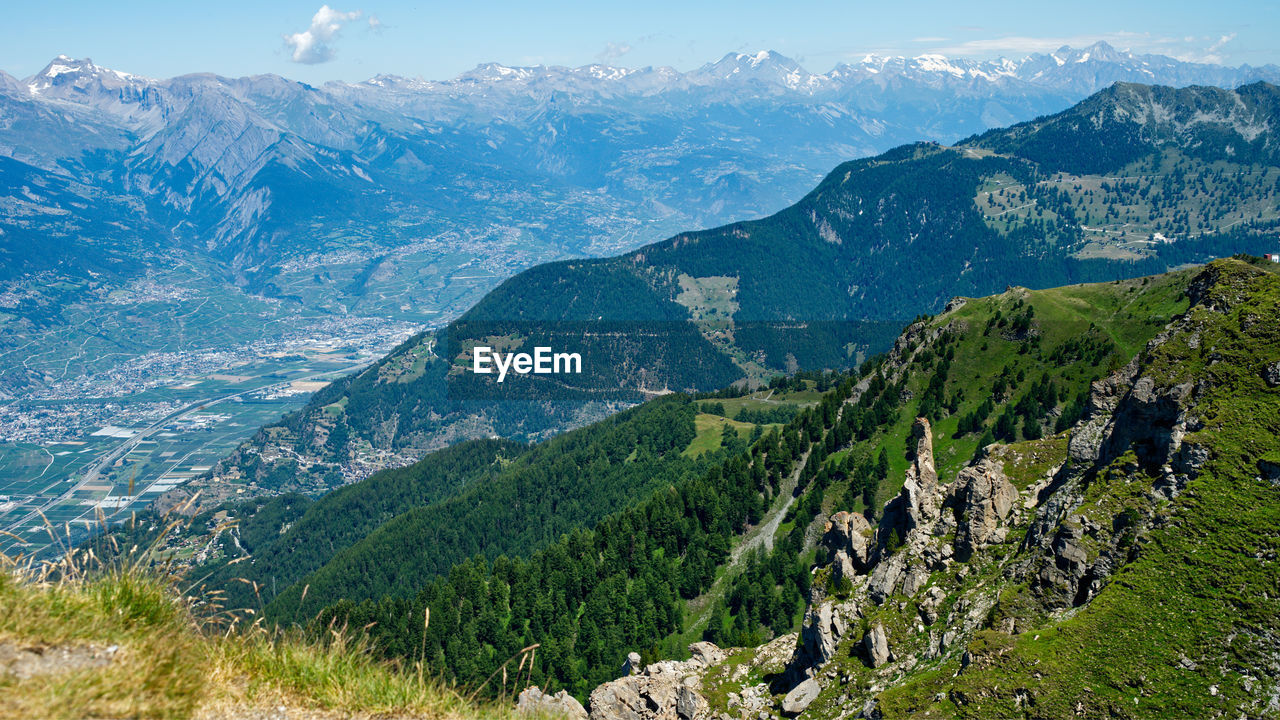 High angle view of landscape and mountains against sky