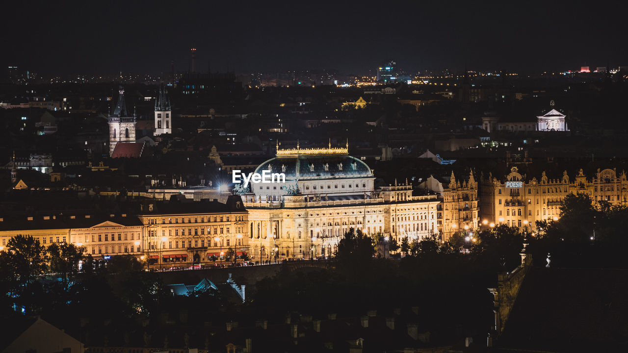 High angle view of illuminated buildings in city at night