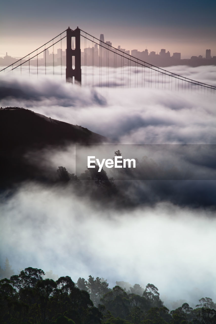 View of suspension bridge in foggy weather