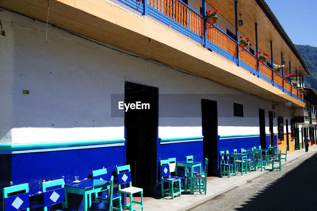 PANORAMIC VIEW OF BUILDINGS AGAINST BLUE SKY