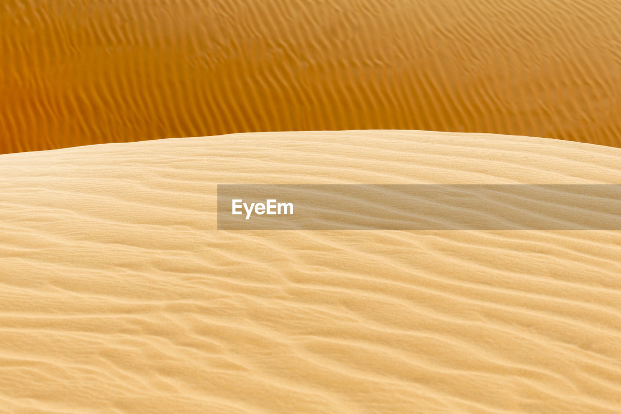Sand pattern with shallow depth of field in the desert, uae