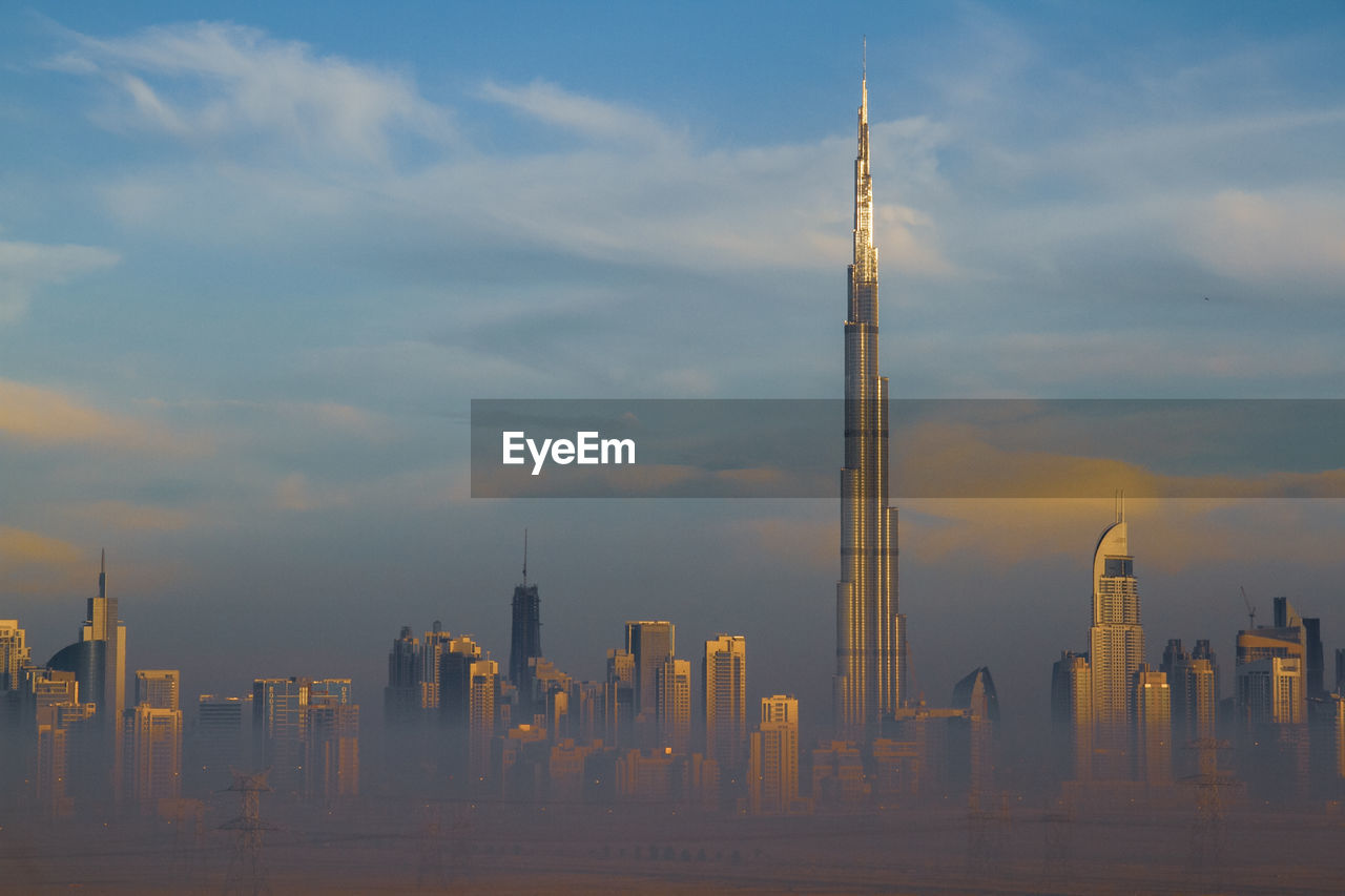 PANORAMIC VIEW OF BUILDINGS IN CITY AGAINST SKY