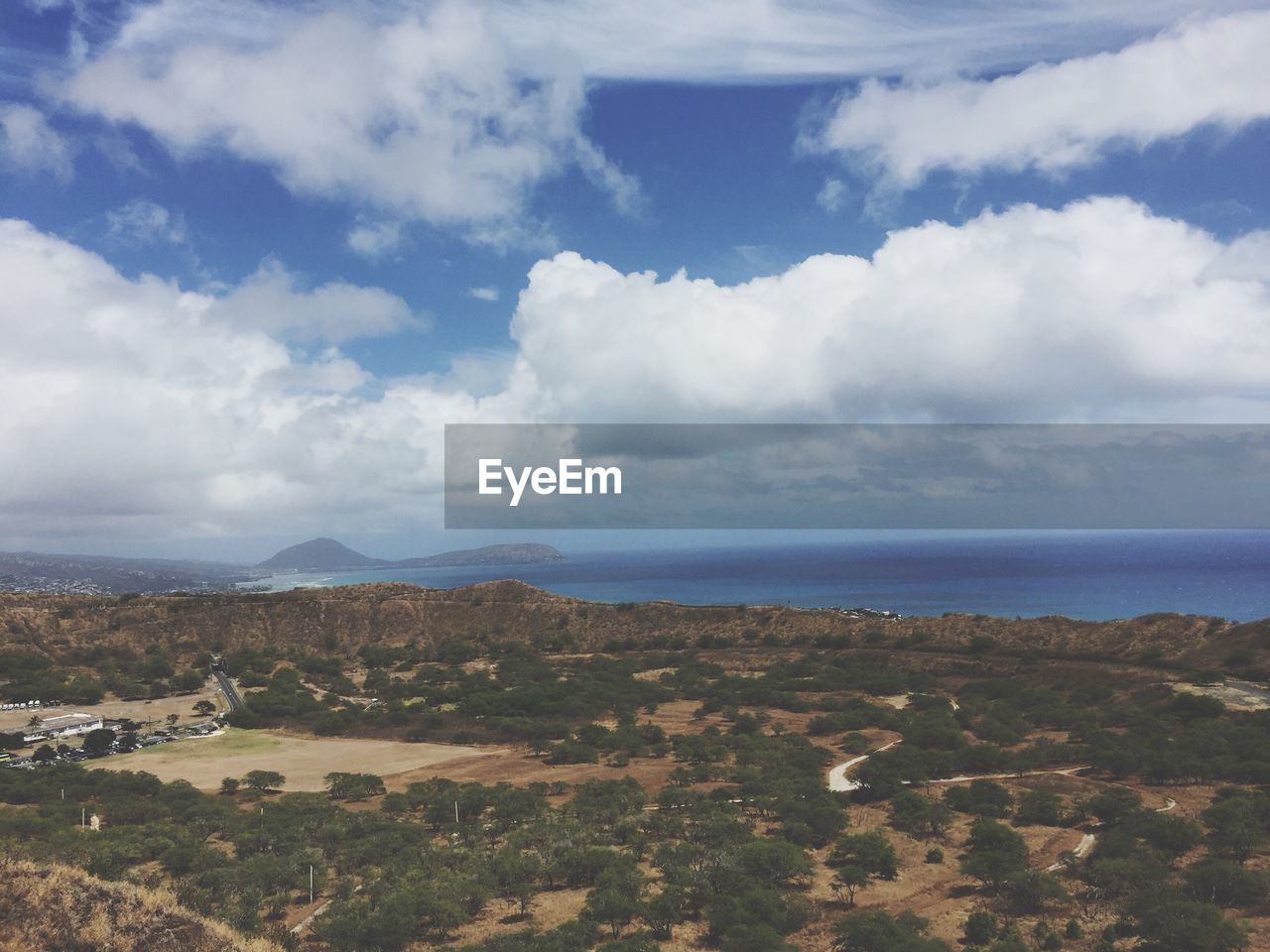 Scenic view of calm sea against cloudy sky