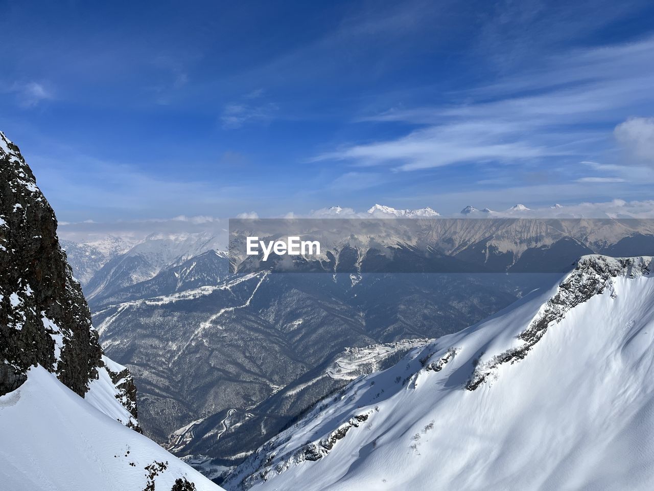 scenic view of snow covered mountains against sky