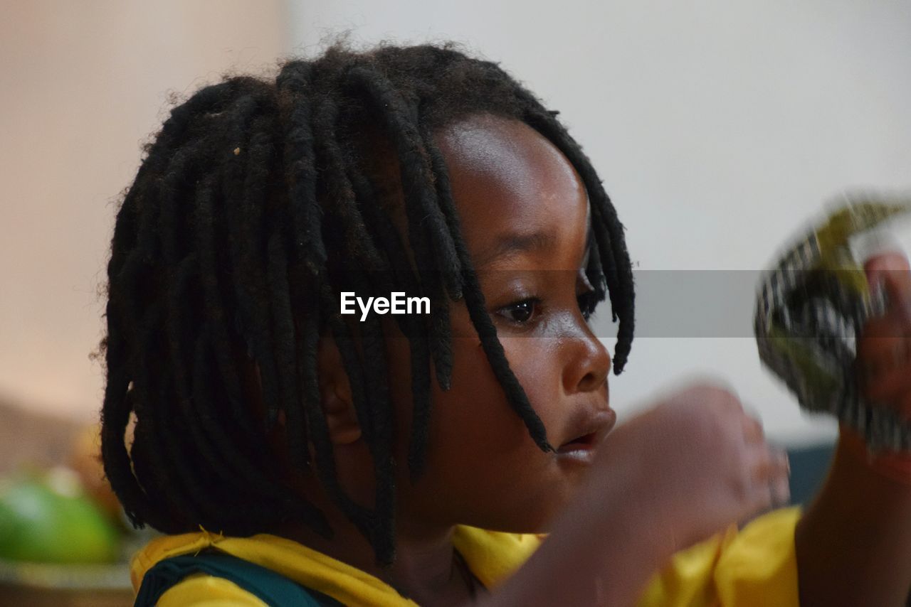 Close-up of girl with dreadlocks