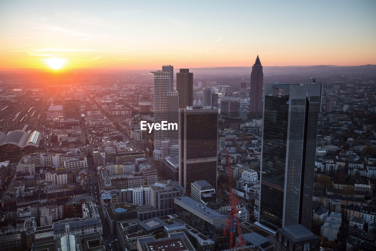 Aerial view of city at sunset