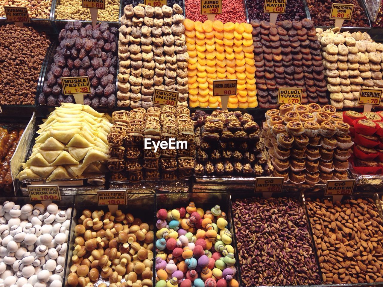 High angle view of various dried fruits for sale at market stall