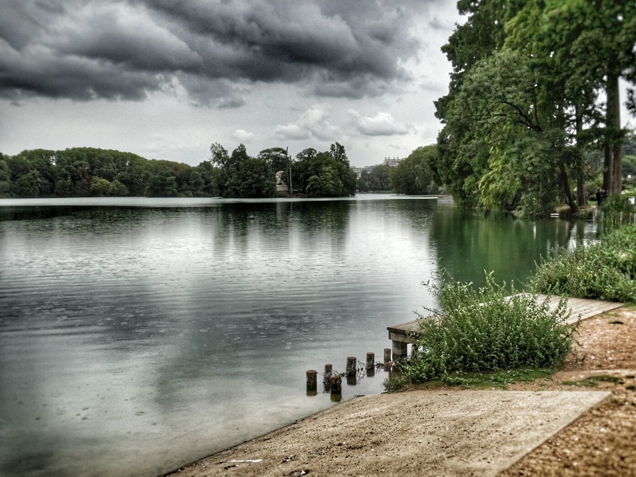 SCENIC VIEW OF CALM LAKE AGAINST SKY